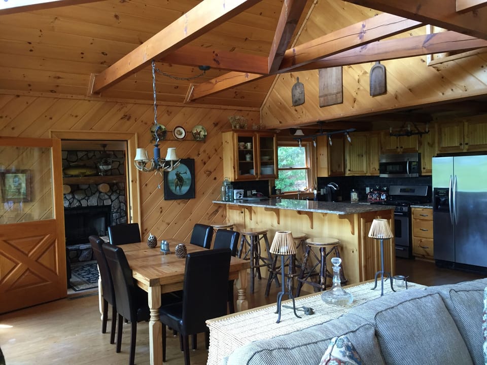 Dining areas with view of private den (has flatscreen TV)