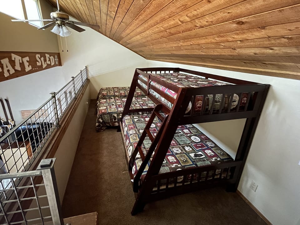 Loft with 2 twin beds, twin over full bunkbed, and dresser