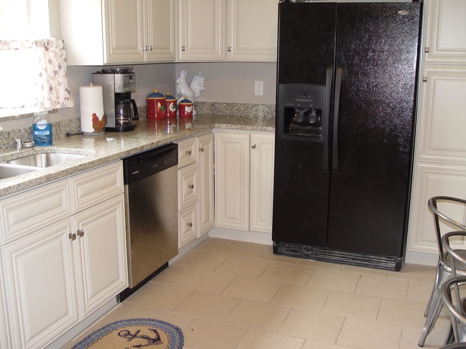 Well stocked kitchen, dishes, pots, pans, coffee & filters, pot, & crock pot.