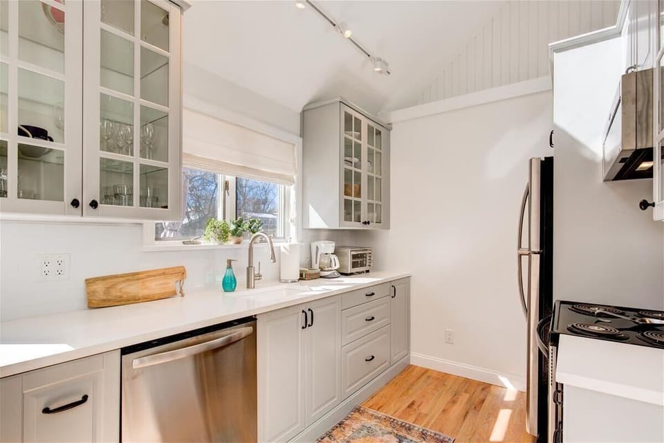 Remodeled kitchen with brand new appliances and quartz countertops. 