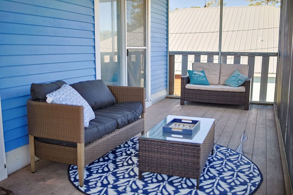 Covered Outdoor Patio upstairs with Seating