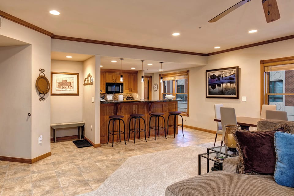 Mud room, bar into kitchen, original art throughout 