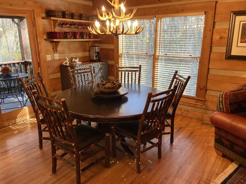 Dining with beautiful views; easy access through French doors to back porch.