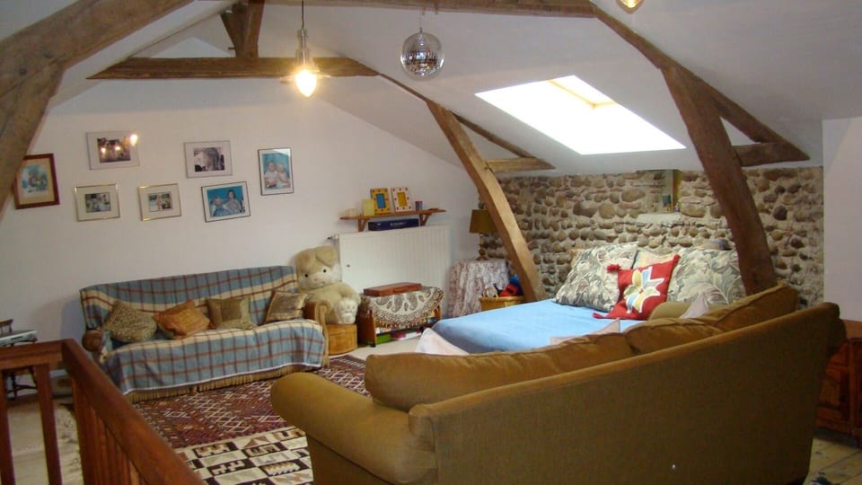 Upstairs living room/Children's playroom with TV, DVD, games and toys.