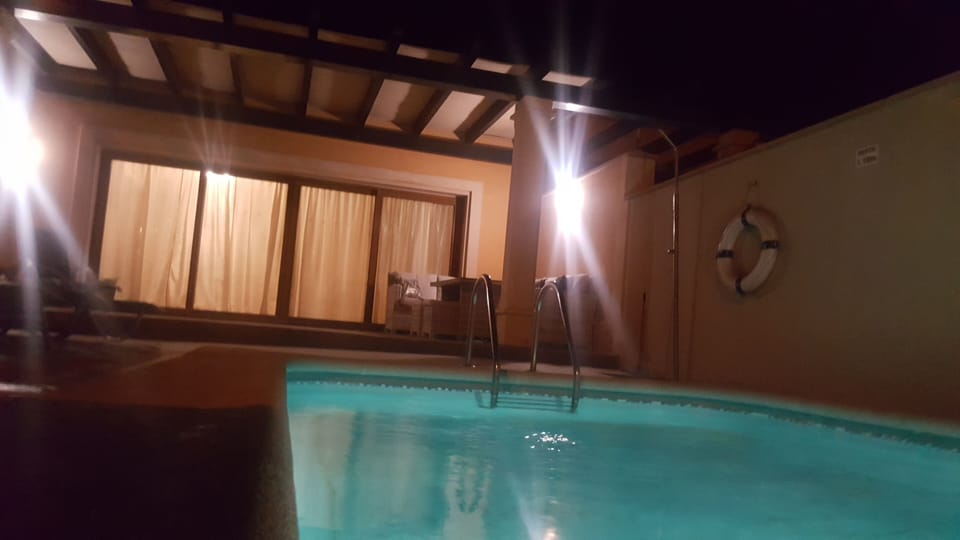 Pool at night with pool light 