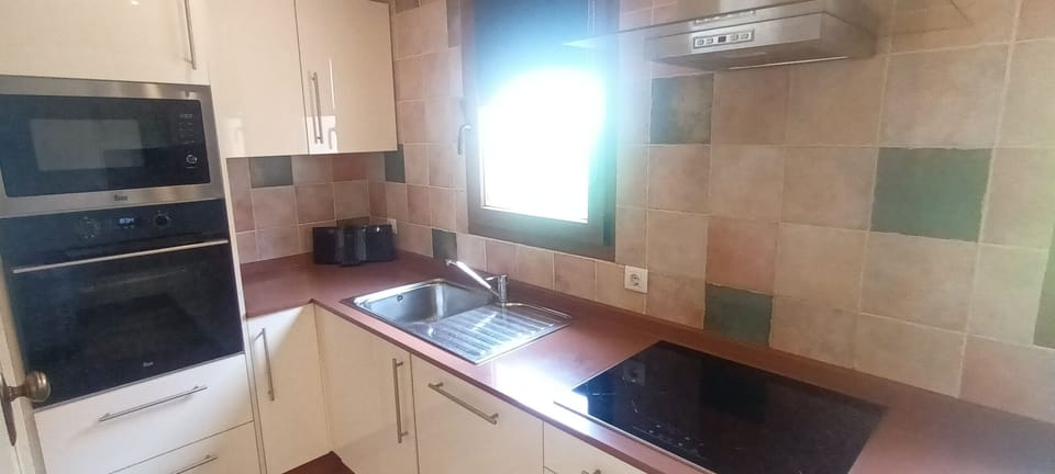 Kitchen fully kitted out including oven, hob, dishwasher, microwave.