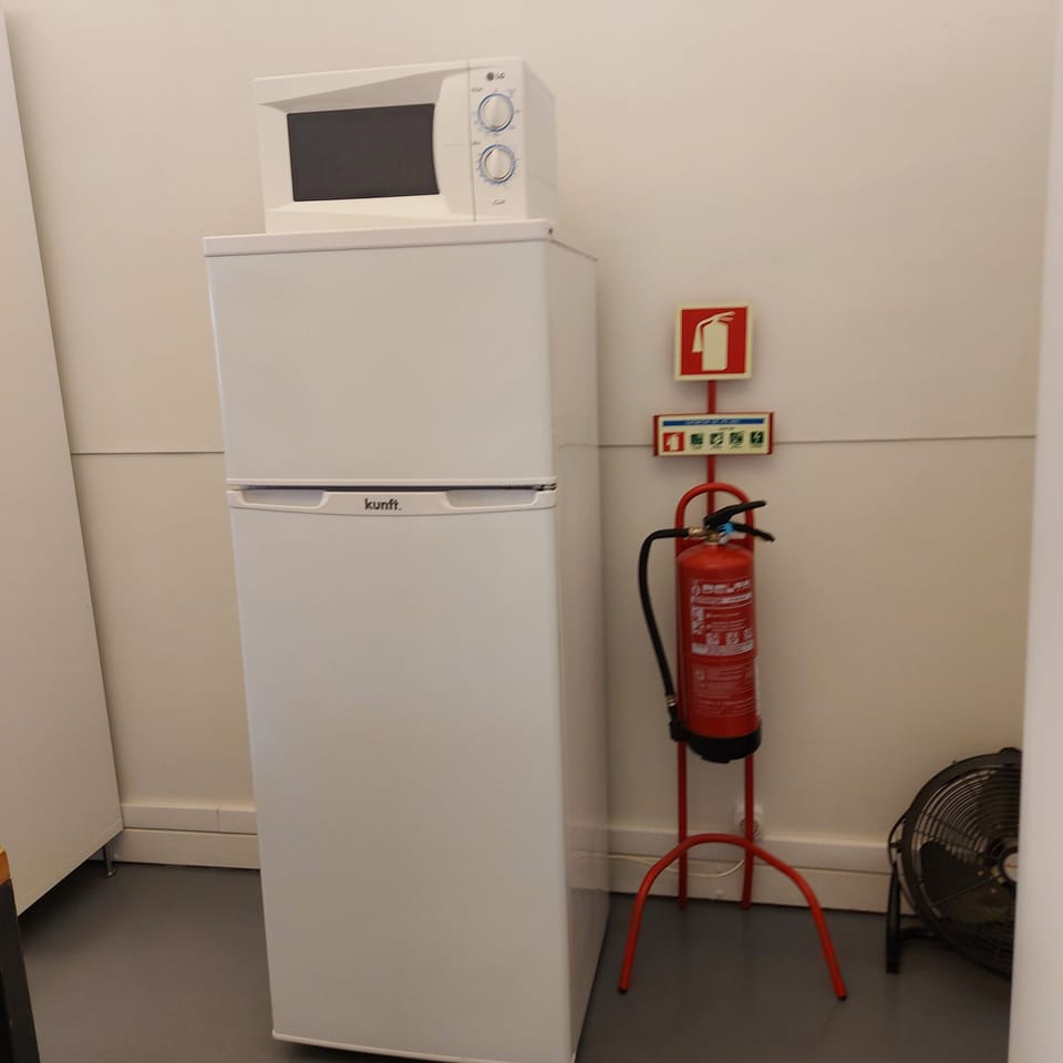 Fridge next to dining area.