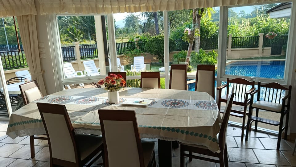 Air-conditioned dining area for 8 people plus 2 baby high chairs