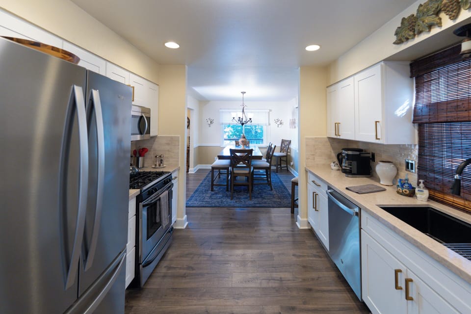 Open plan kitchen wrapping around to dining & family room, patio deck adjacent! 