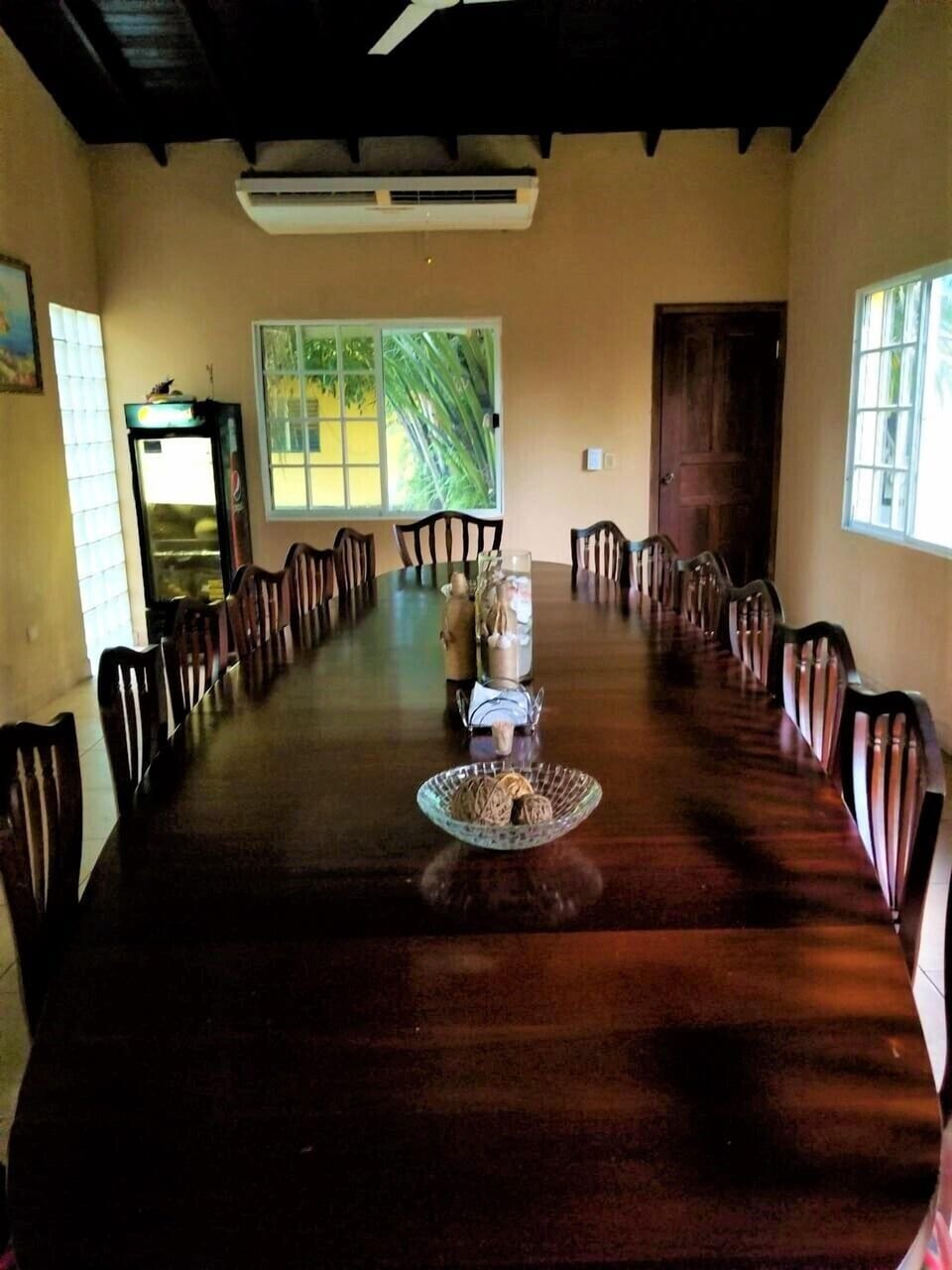 Large redecorated dining room with Louis XV mahogany table for 16 people.