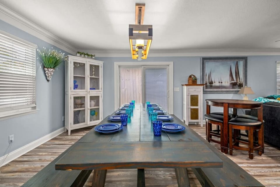 Gather round the spacious dining room table with seamless transition to the kitchen and living room!