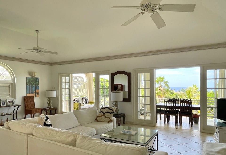 The sitting area is large and open plan with French doors onto the balcony