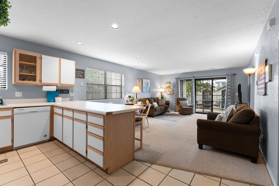 Cook, snack, or chat with the group in a bright open layout that keeps everyone connected.
