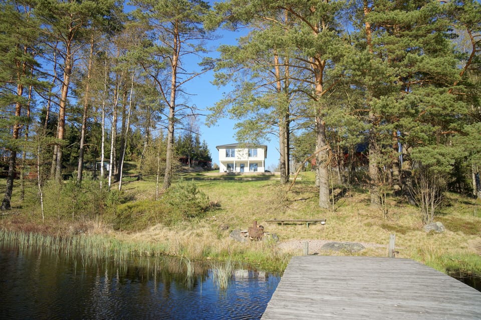 View from the lake (the small buildings to the left belong to the house)
