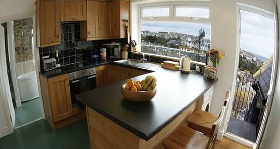 The large kitchen and door to the balcony for Alfresco dining 