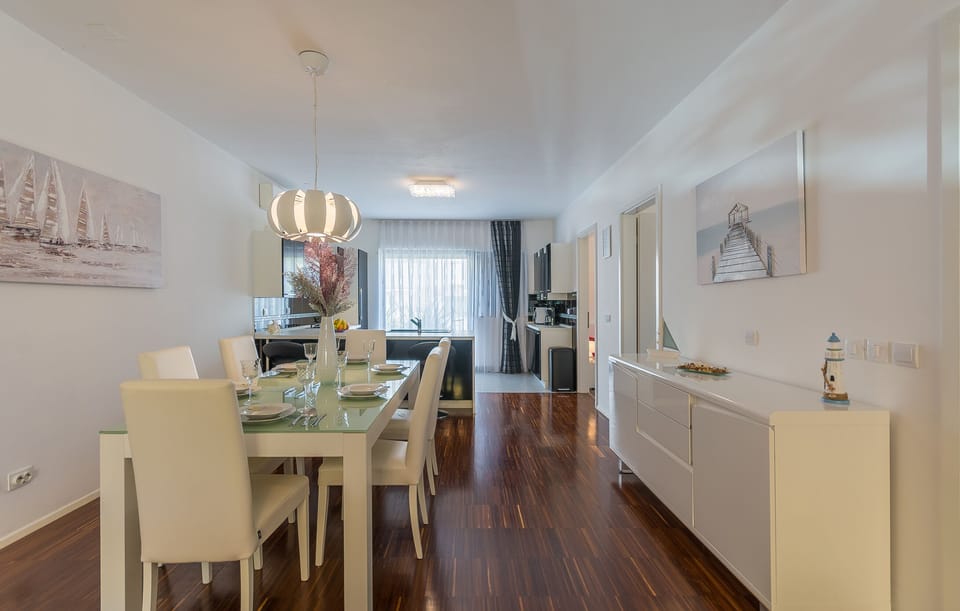 Spacious sunny dining room with 2 air conditioners.