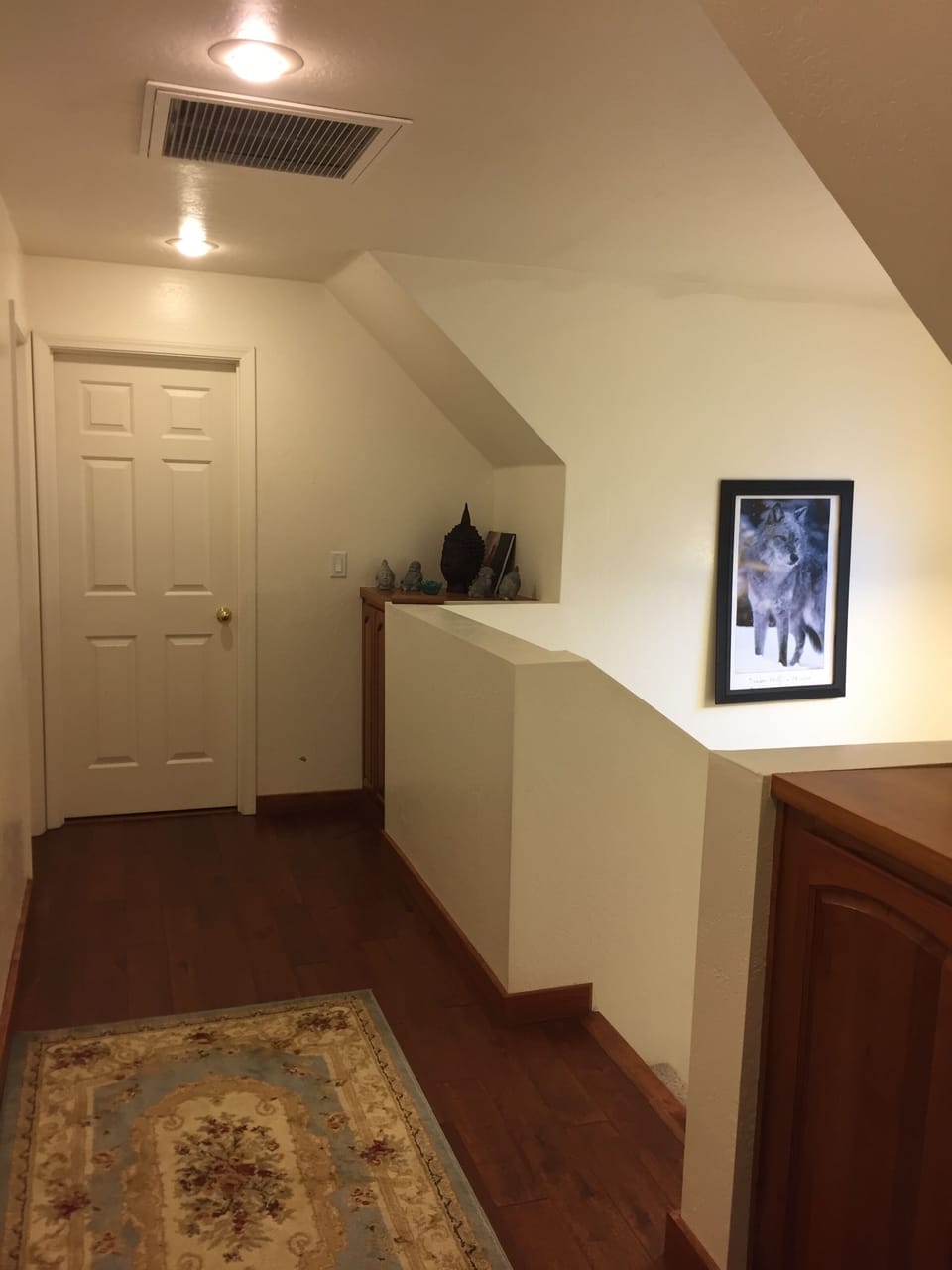 Hallway between upstairs bedrooms, allowing for privacy and quiet space.