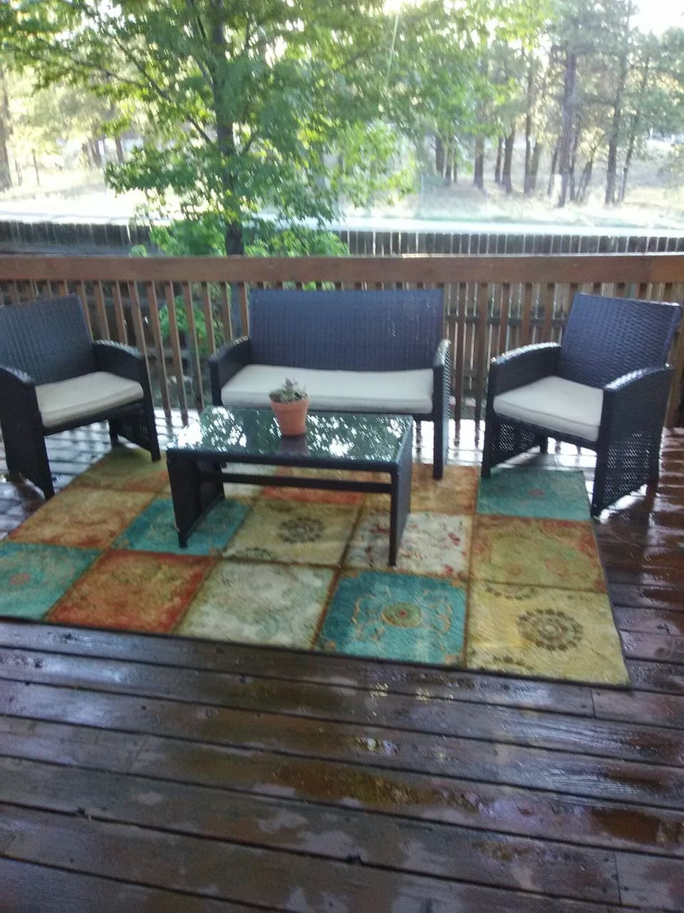 Relaxing outdoor deck surrounded by beautiful pines. Gas grill is awesome!