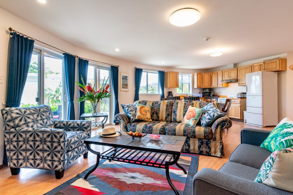 This spacious living, dining and kitchen area offers American style furniture.