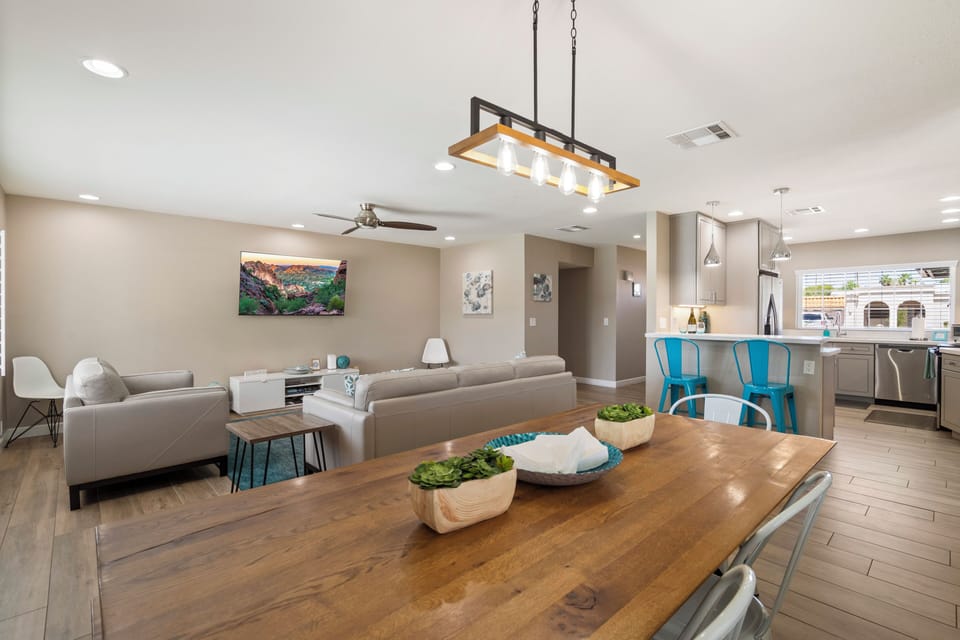 Open floorplan with large living room, 2 4K TVs, Kitchen and Dining Room