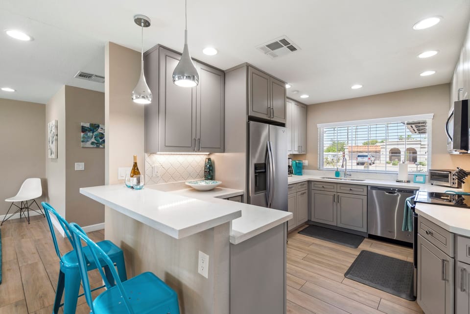 Modern Kitchen with white quartz countertops and Stainless appliances