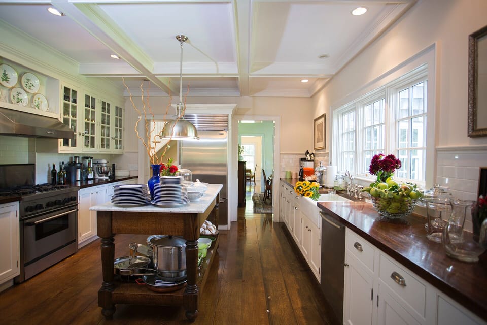 Chef's kitchen with 40' of counter and island space. With wide-plank oak floor. 
