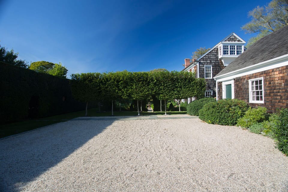 Parking court and entry to English formal garden inside 20' hedges. 