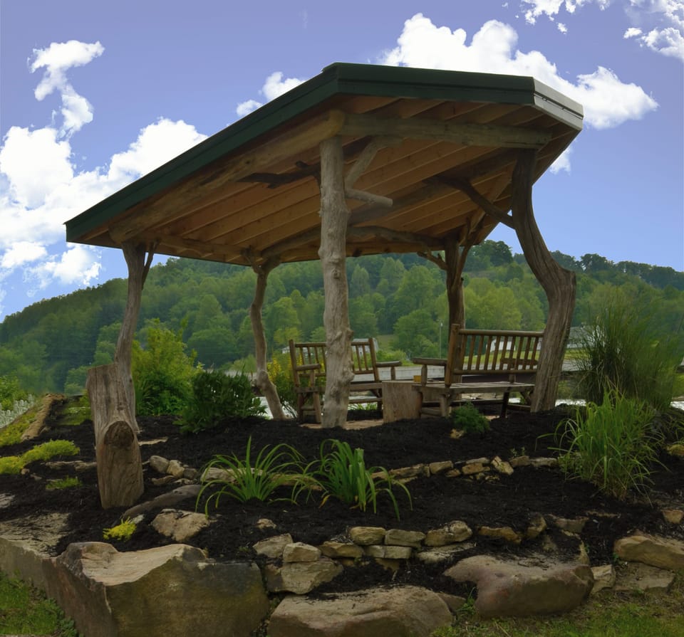 Driftwood gazebo created by artisan Josh Hubbard. Seating by Tygart River.