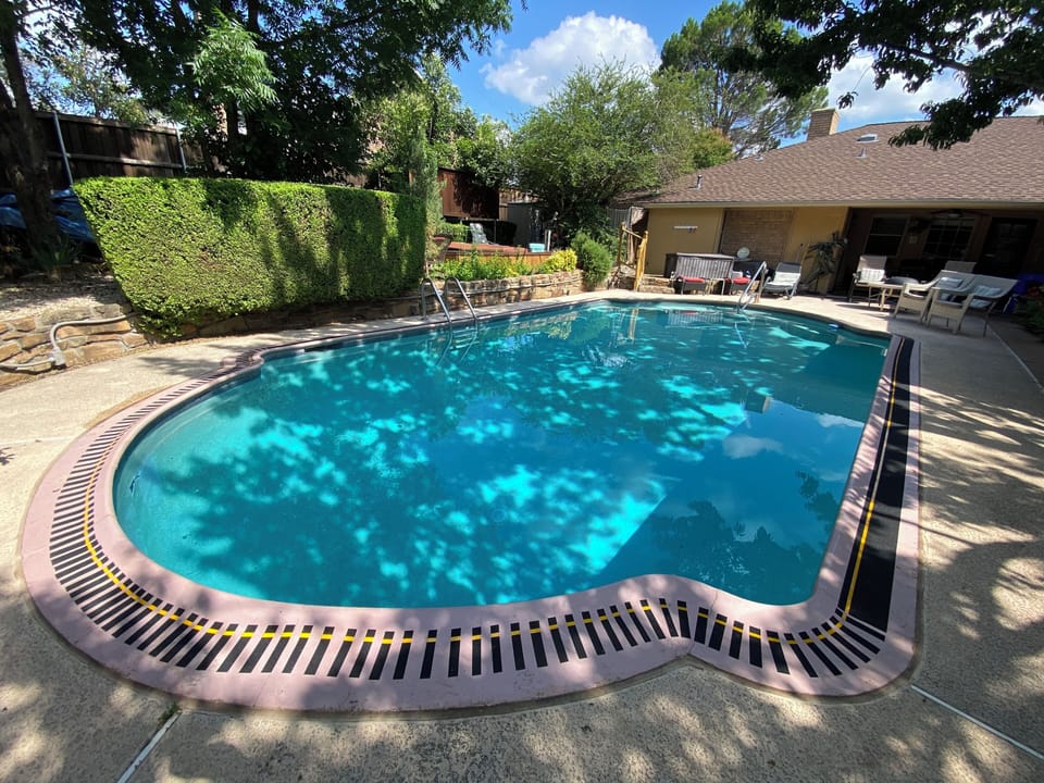 Lots of natural shade on this gorgeous large swimming pool!