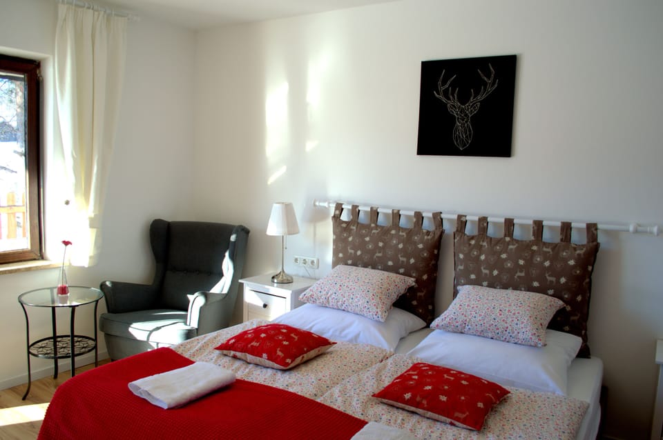 A large double room with spacious bathroom and access to a 70m2 roof terrace.