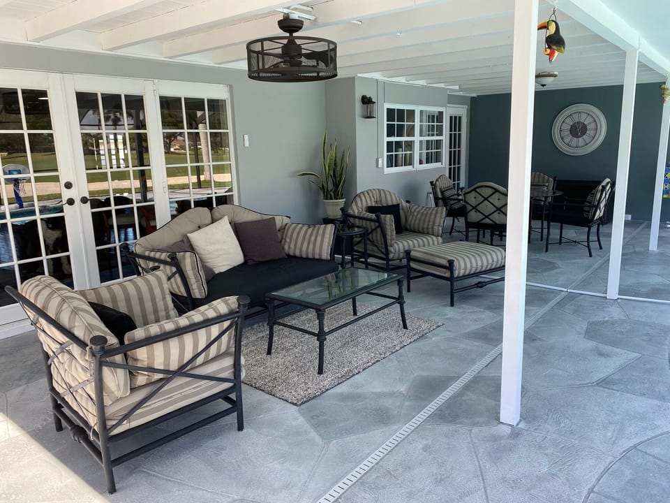 Lounge area on the newly remodeled lanai, with comfortable outdoor furniture.