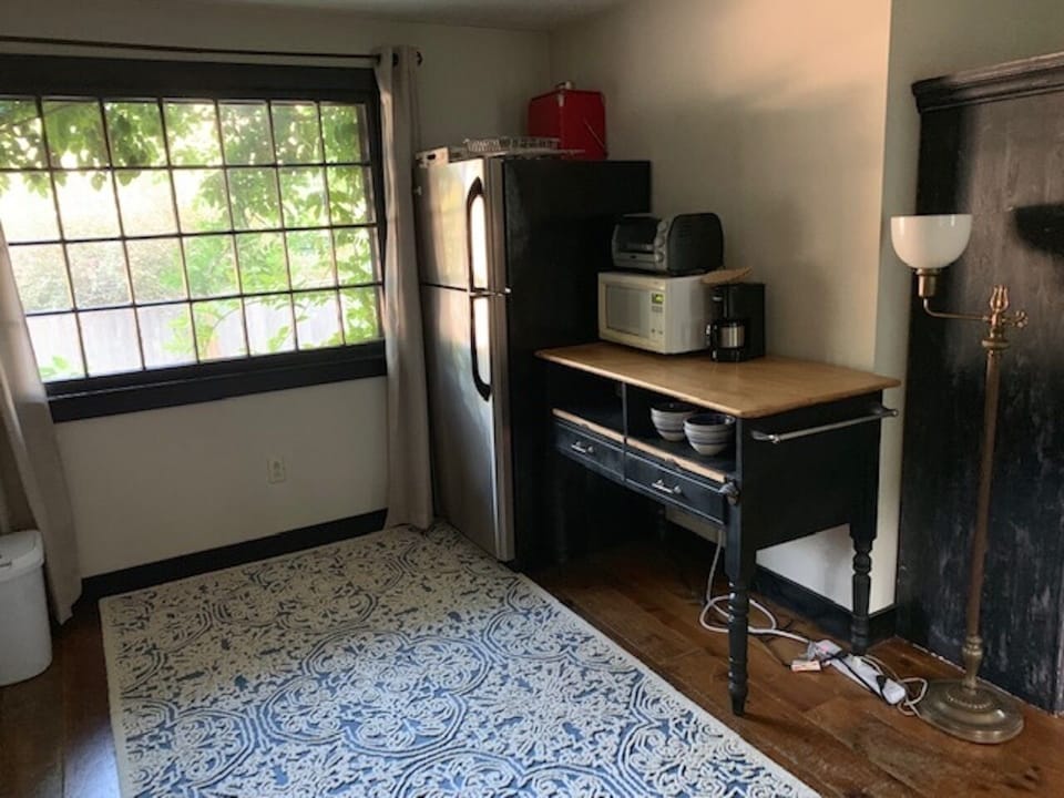 The Cottage work counter has a microwave, toaster oven and coffee pot.