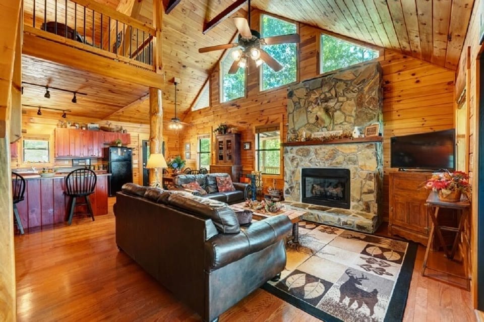 Living room with gas fireplace and plenty of natural light