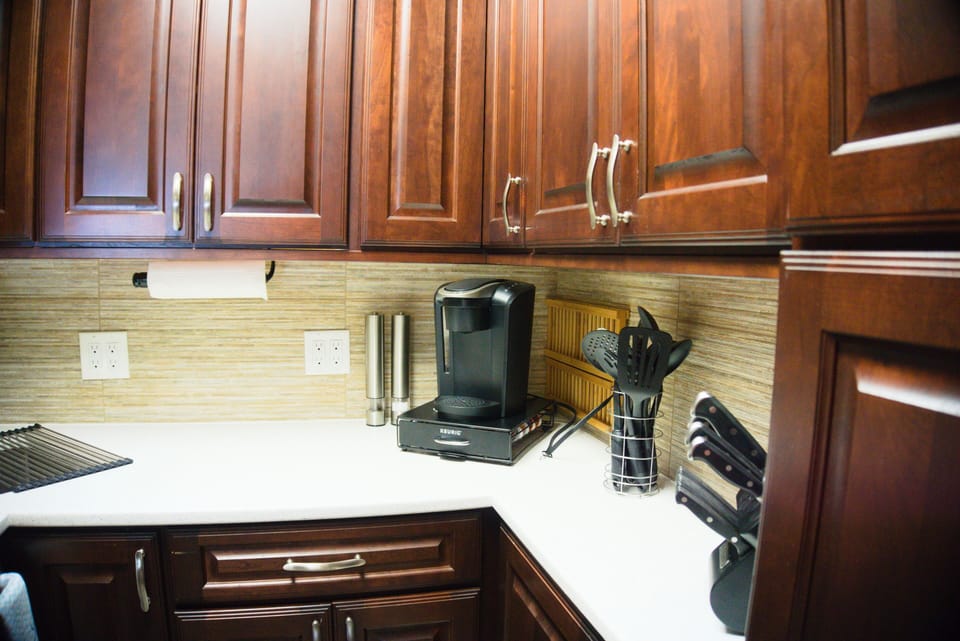 Kitchen equipped with many essentials.  