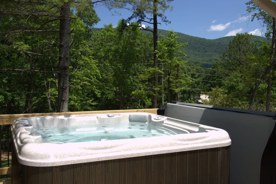 Hot tub on back with mountain view. 