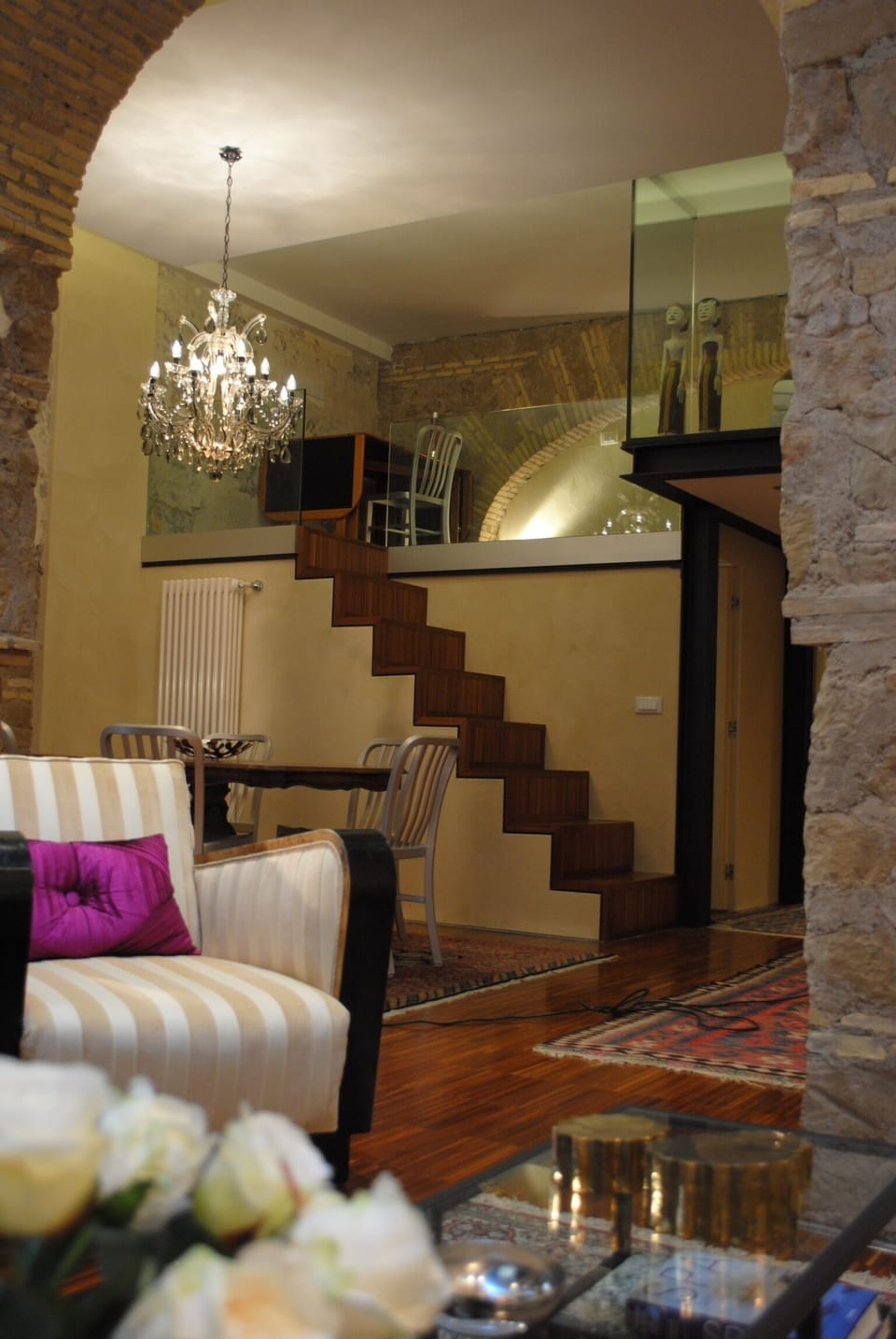View of living and stairs going to mezzanine bedroom
