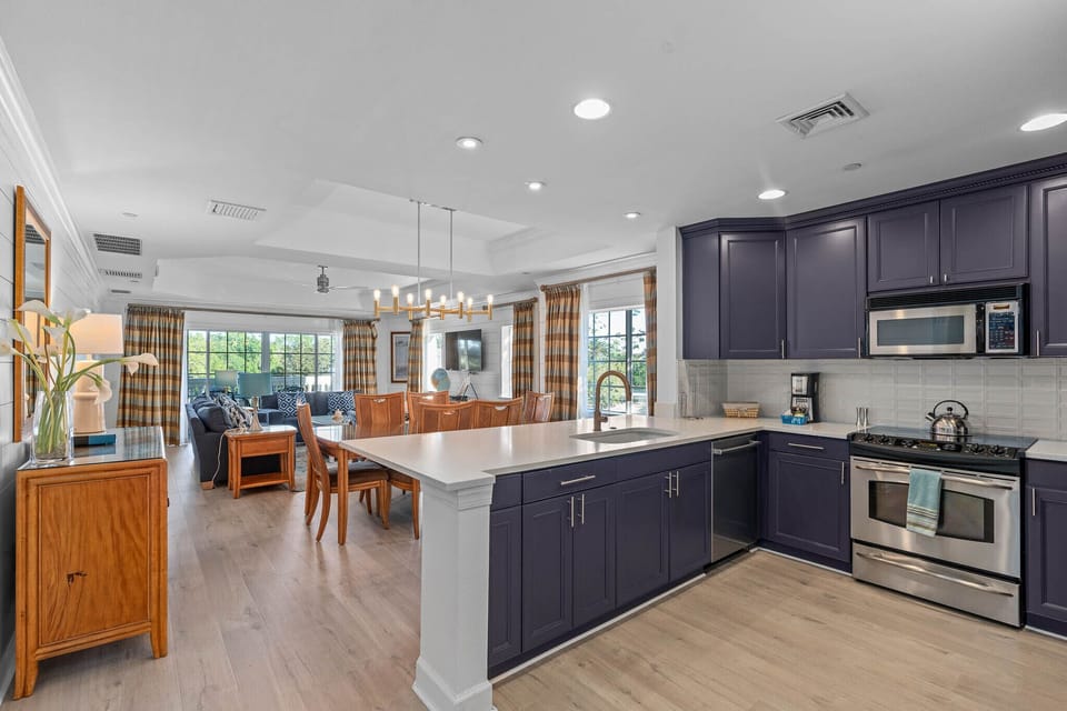 Open floor plan kitchen overlooking dining and living area. 