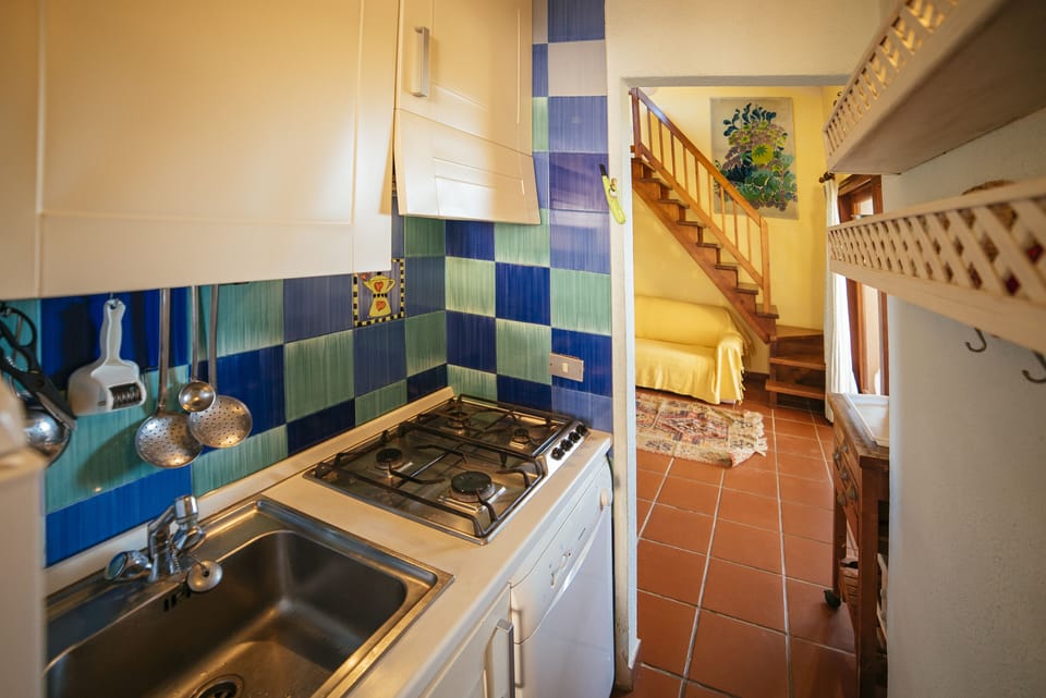The kitchen is small but functional, fully equipped with everything you need.
