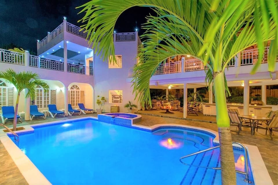 Just add yourself for a complete picture! Guests love our salt water pool and pool-side hot tub. Outdoor pool side mini-kitchen has a charcoal grill