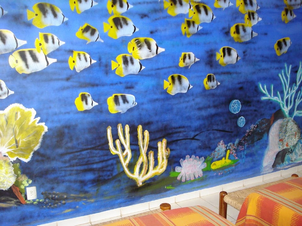 Twin Beds Look On To This Mural. 