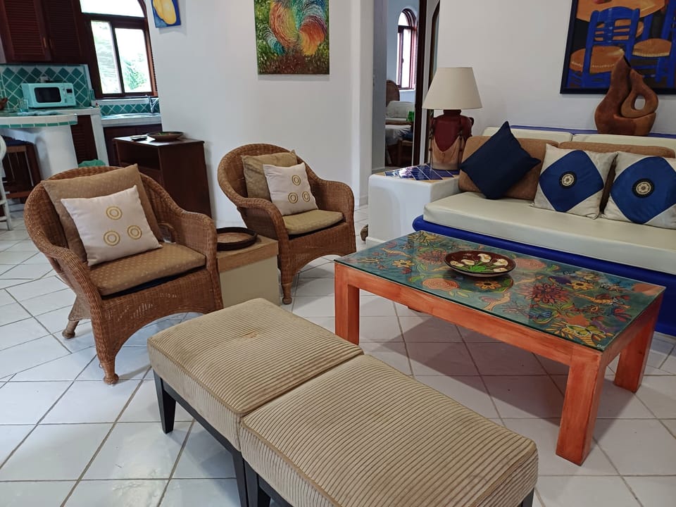 Living room looks on to balcony 