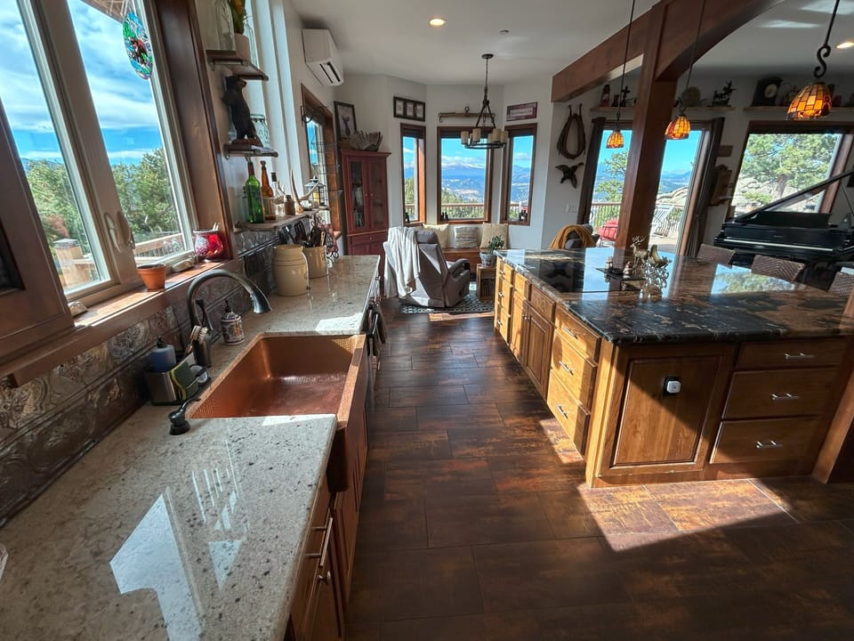 Granite counters, A/C, induction stovetop, copper sink, antique backsplash,views