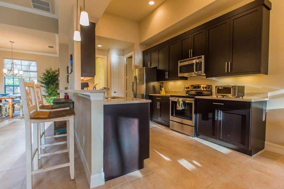 Custom Cabinets and Stainless Steel Kitchen  with integrated Pub Counter