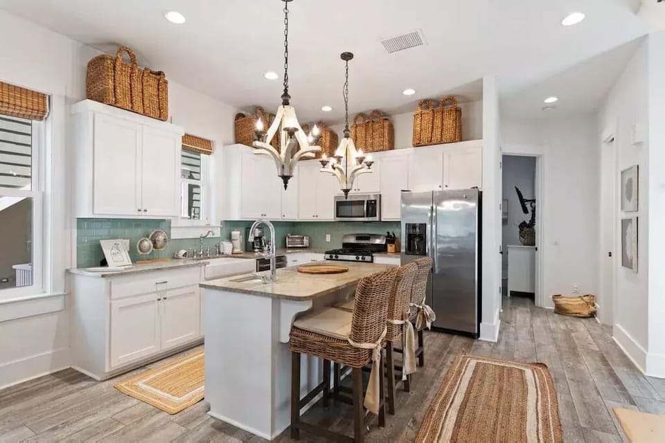Chefs kitchen with 2 sinks, gas range and eat in breakfast bar. 