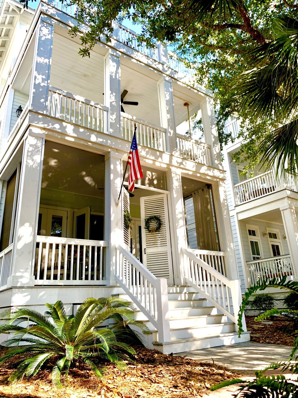 Sprawling porches wrap the front of the house.