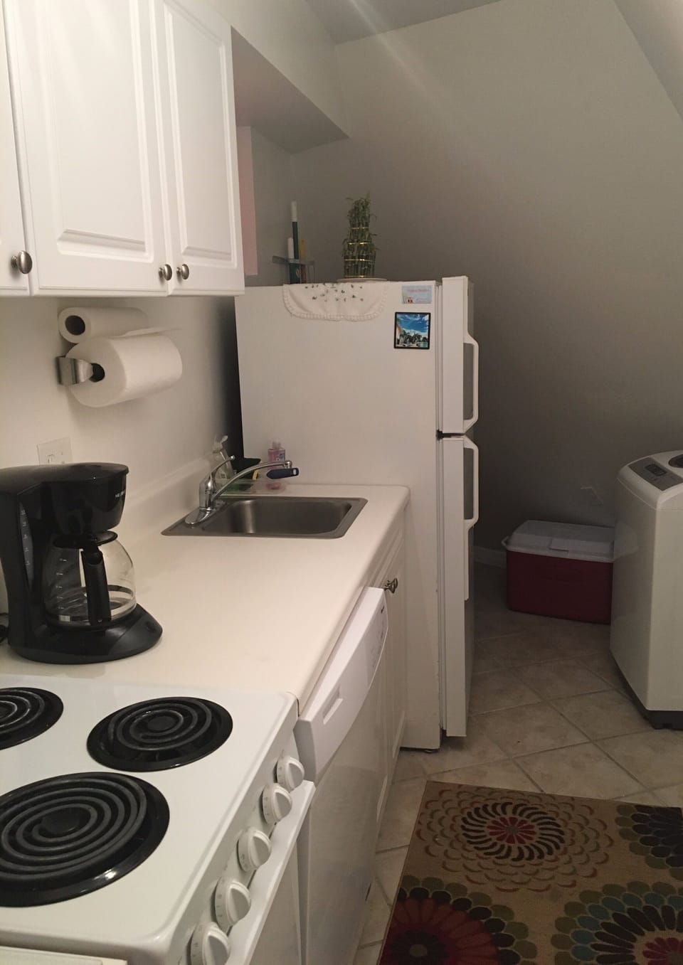 fully equipped kitchen with washer and dryer