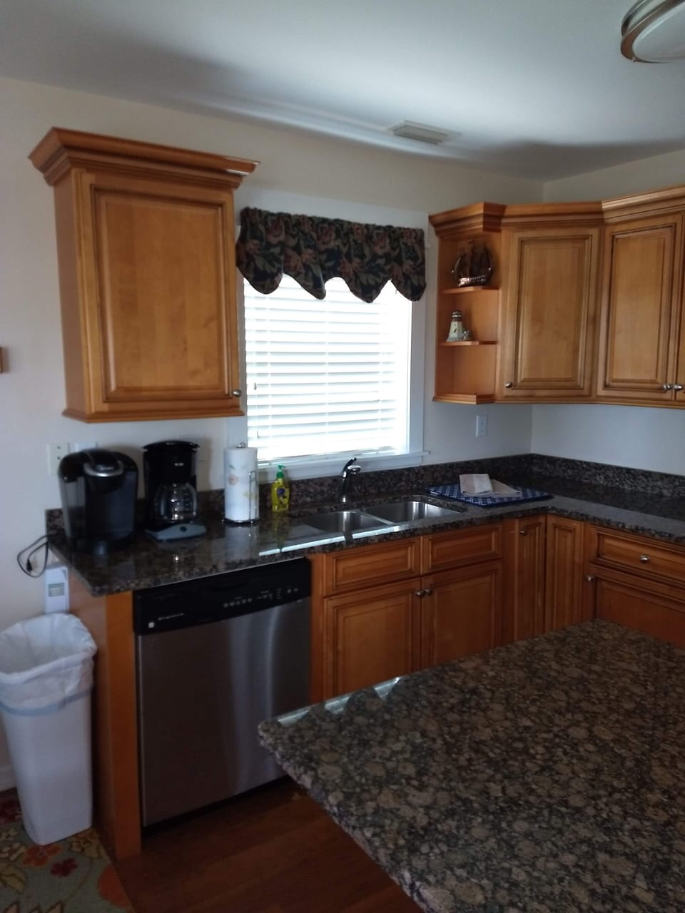 Kitchen with loads of courtesy spices and goodies, open to dining and living rm