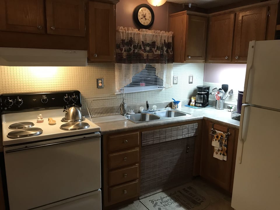 Kitchen stocked with dishes, pots, pans, appliances and all the essentials . . .