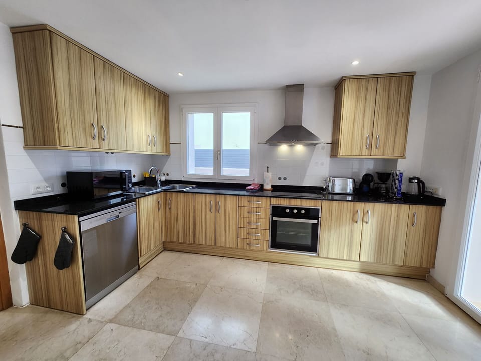 Modern kitchen with coffee machine and more
