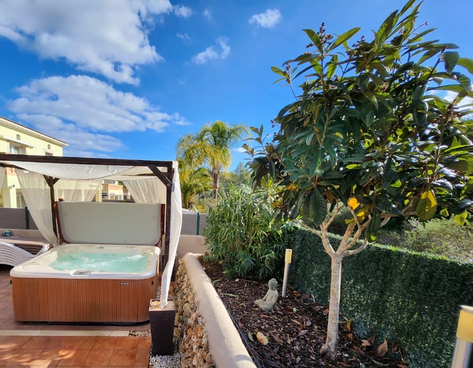Jacuzzi oasis amid lush greenery